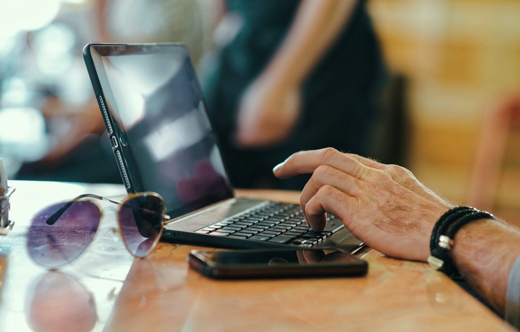 Hand working on a laptop