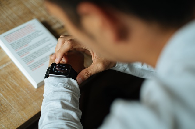 A boy adjusting his smart watch